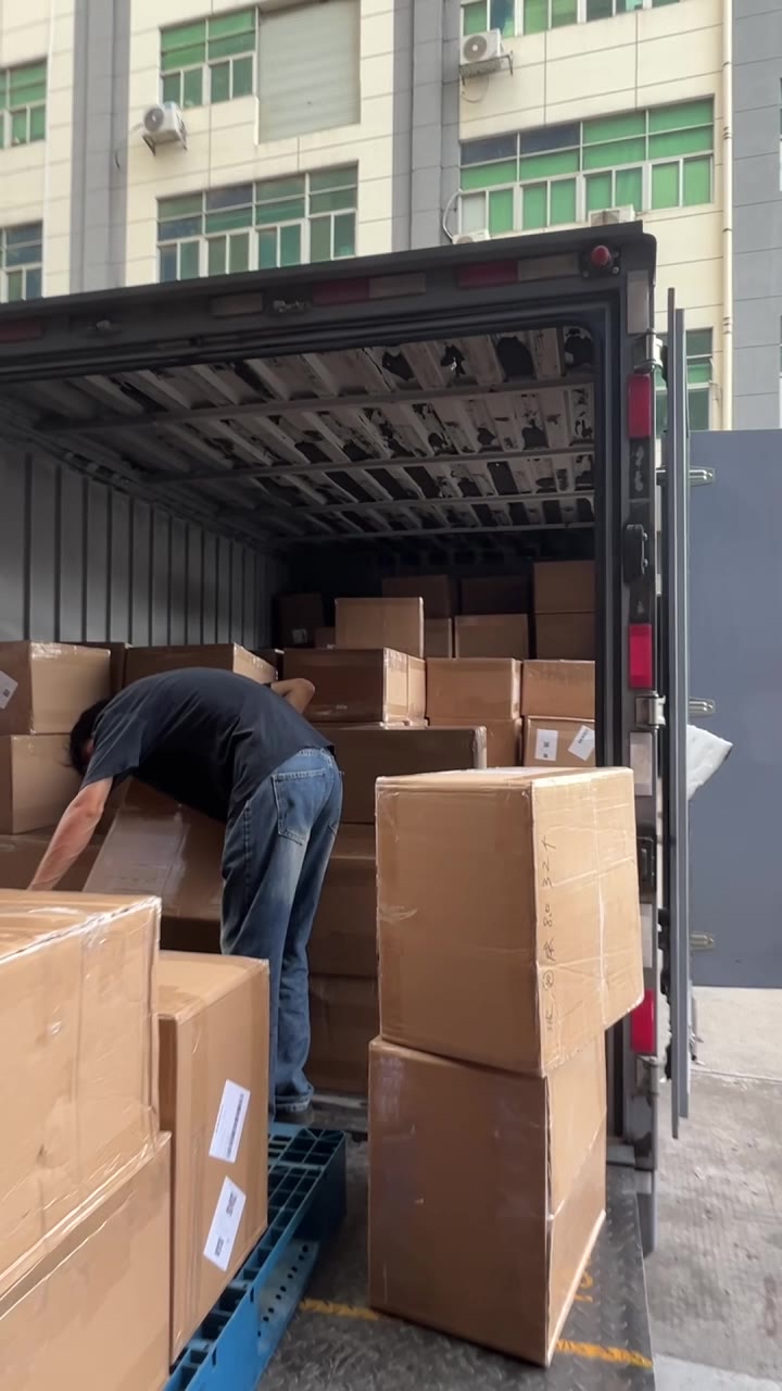 Cartons being moved for loading at a logistics site